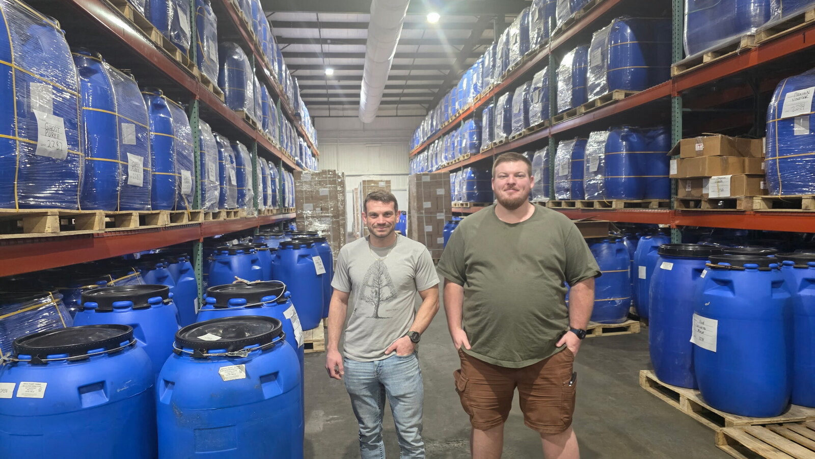 Gabe and Matthew with barrels of peppers